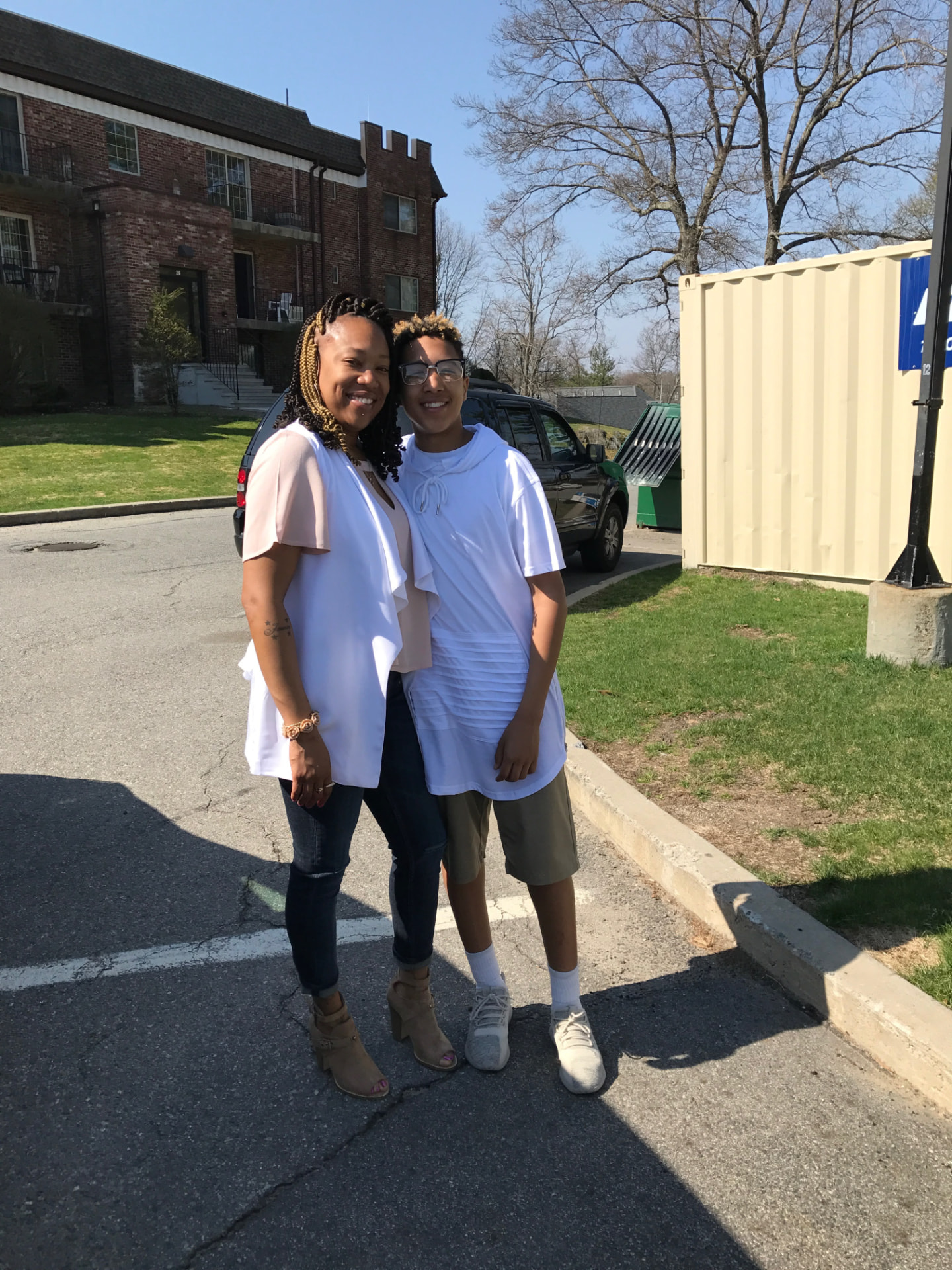 Debra outdoors with a family member on a bright spring day