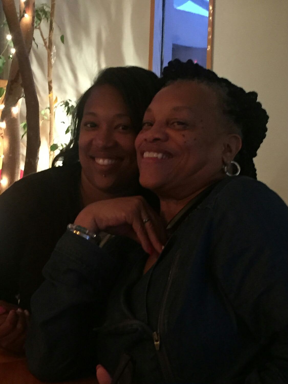 Debra sharing a close, affectionate moment with a family member