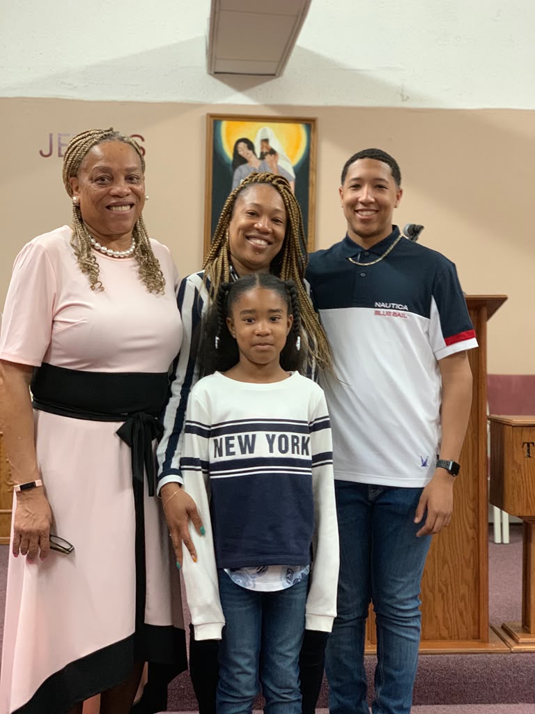 Debra with three generations of family gathered together